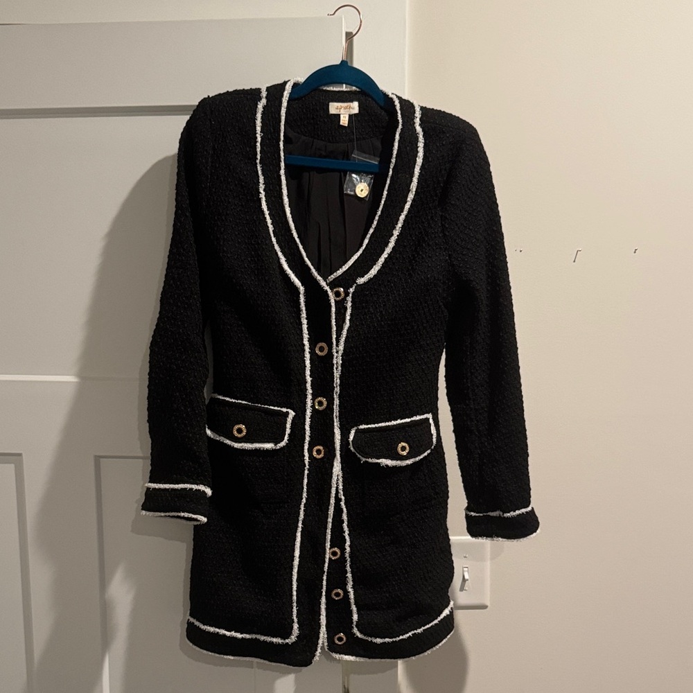 a peach Black jacket with White Trim